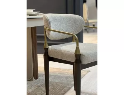 Flora Chair with wooden legs and metal armrests